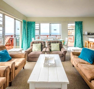 A spacious living room with two comfortable couches flanking a stylish table, ideal for gatherings and leisure activities. A spacious living room with two comfortable couches flanking a stylish table, ideal for gatherings and leisure activities.